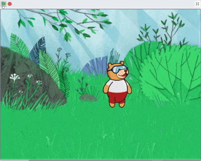 PictoBlox stage showing Tobi the bear walking back and forth on a green outdoor background after running the completed script